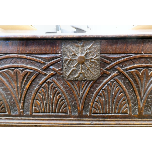 327 - An 18thC planked oak bible box with a lunette carved front panel, the lid on later cast and rivetted... 