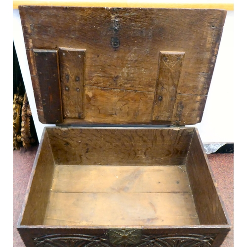 327 - An 18thC planked oak bible box with a lunette carved front panel, the lid on later cast and rivetted... 