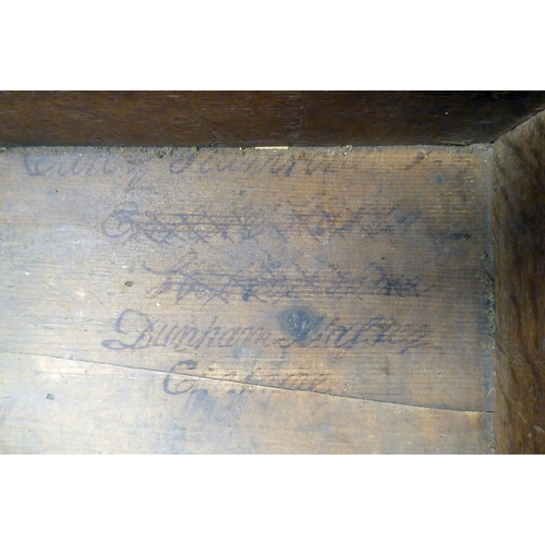 327 - An 18thC planked oak bible box with a lunette carved front panel, the lid on later cast and rivetted... 