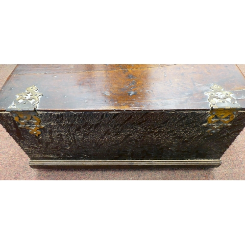 327 - An 18thC planked oak bible box with a lunette carved front panel, the lid on later cast and rivetted... 