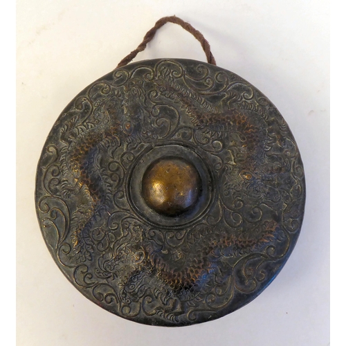 329 - A late 19thC Chinese cast bronze gong, decorated with dragons and scrolled ornament  9