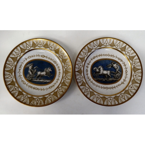 333 - A pair of early 19thC French porcelain plates, decorated with cupid charioteers and gilt ornament, i... 