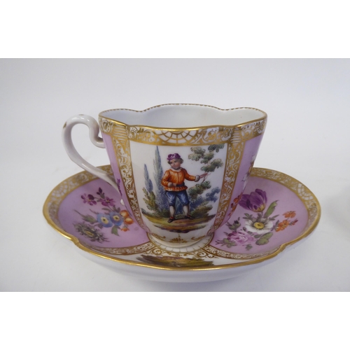 337 - A pair of late 19thC Austrian porcelain cups and saucers of oval outline, decorated in panels with f... 