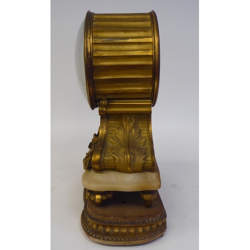 344 - A 19thC French gilt metal, drum cased mantel clock, on an onyx plinth and platform; the bell strike ... 