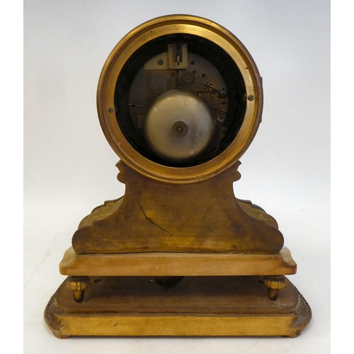 344 - A 19thC French gilt metal, drum cased mantel clock, on an onyx plinth and platform; the bell strike ... 