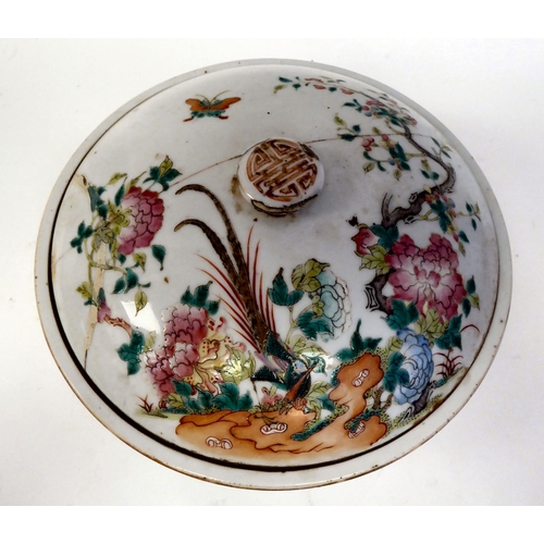 345 - A 19thC Chinese porcelain serving dish and domed cover, decorated with flora, birds and insects, in ... 