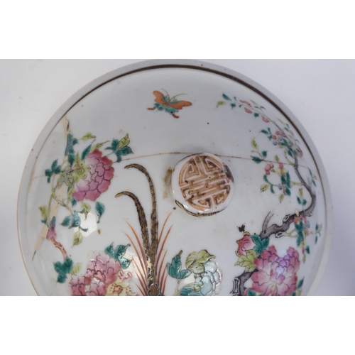 345 - A 19thC Chinese porcelain serving dish and domed cover, decorated with flora, birds and insects, in ... 