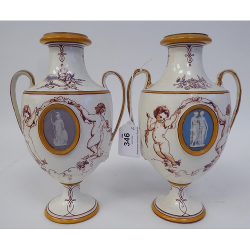 346 - A pair of 19thC Wedgwood cream glazed earthenware, twin handled, ovoid shape, pedestal vases, decora... 