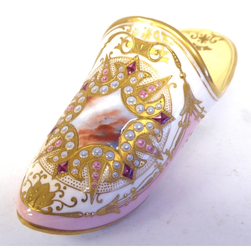 61 - A Coalport china model slipper, decorated in pale yellow and pink with applied sequins and highlight... 