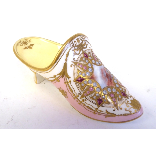 61 - A Coalport china model slipper, decorated in pale yellow and pink with applied sequins and highlight... 