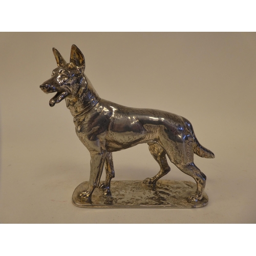 70 - A cast white metal model, a standing German Shepherd, impressed Diller and No.25226, on a plinth  6