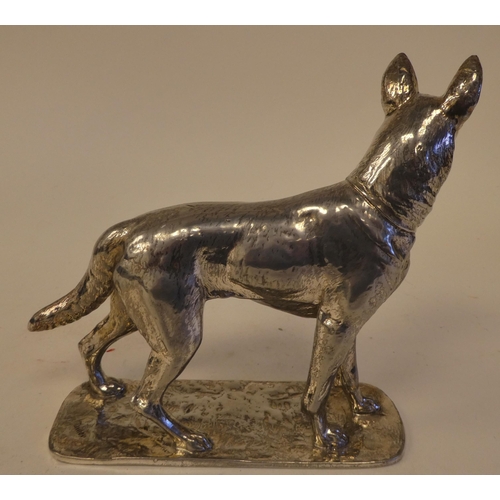 70 - A cast white metal model, a standing German Shepherd, impressed Diller and No.25226, on a plinth  6