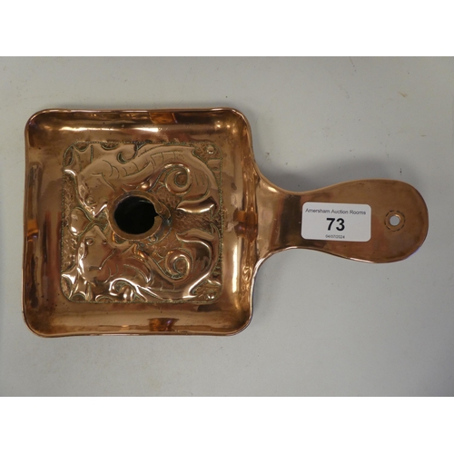 73 - An Arts & Crafts copper chamberstick, the square saucer base embossed and chased with two stylis... 