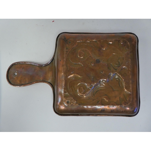 73 - An Arts & Crafts copper chamberstick, the square saucer base embossed and chased with two stylis... 