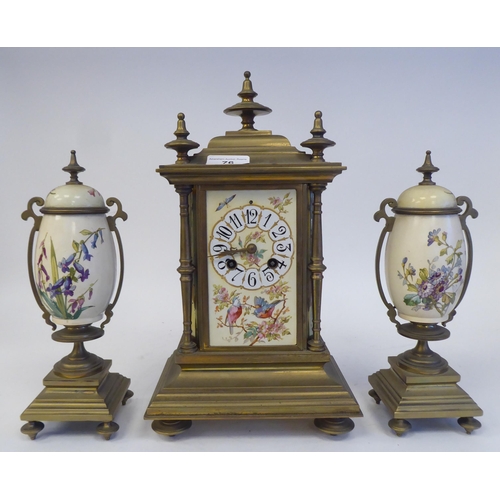 76 - A late 19th/early 20thC three piece brass clock garniture with painted porcelain panels, the clock w... 