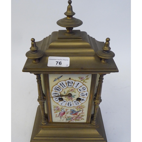 76 - A late 19th/early 20thC three piece brass clock garniture with painted porcelain panels, the clock w... 