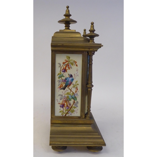 76 - A late 19th/early 20thC three piece brass clock garniture with painted porcelain panels, the clock w... 