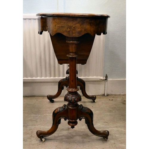 8 - A mid Victorian figured walnut, oval needlework table with marquetry ornament, the quarter veneered ... 