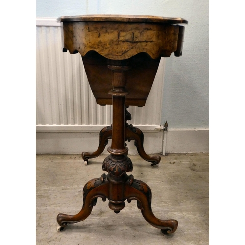 8 - A mid Victorian figured walnut, oval needlework table with marquetry ornament, the quarter veneered ... 