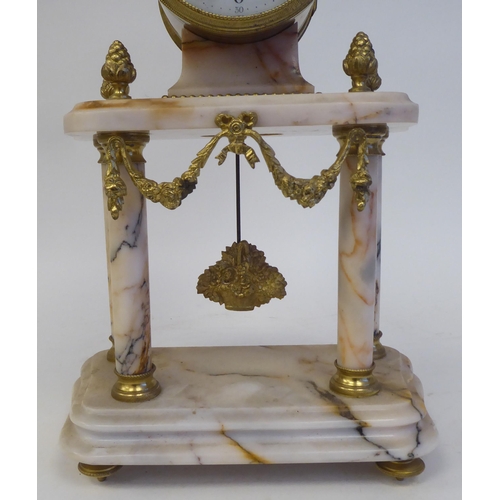 81 - A late 19th/early 20thC French mottled pink marble and gilt metal mounted, three piece clock garnitu... 