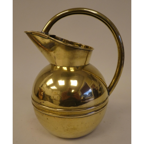 83 - A Christopher Dresser for Henry Loveridge spherical brass water jug with an arched handle and covere... 