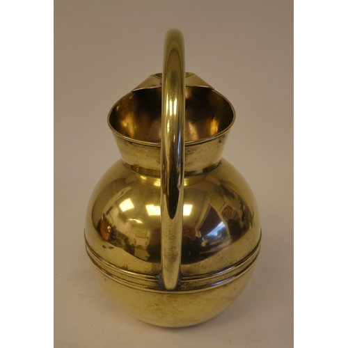 83 - A Christopher Dresser for Henry Loveridge spherical brass water jug with an arched handle and covere... 