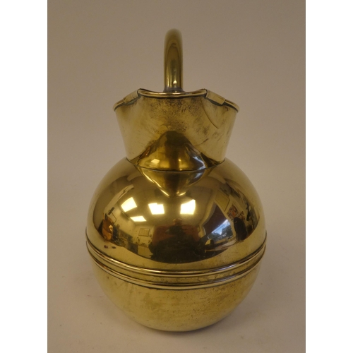 83 - A Christopher Dresser for Henry Loveridge spherical brass water jug with an arched handle and covere... 