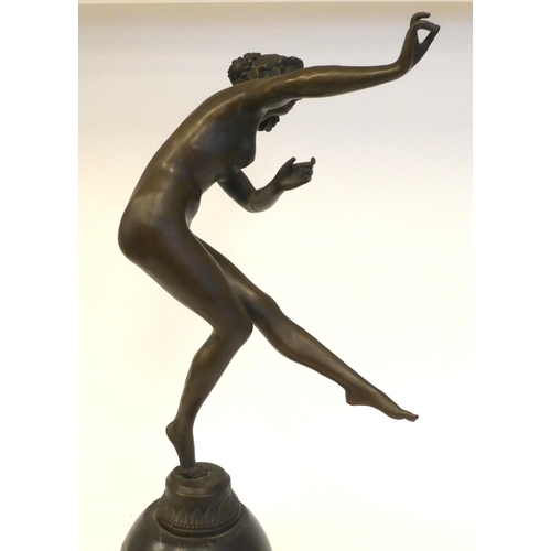 86 - A 19thC style cast and patinated bronze figure, a dancing nude, on a black marble plinth  bears... 