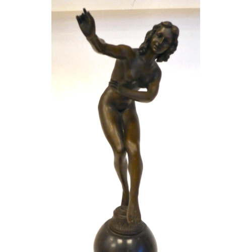 86 - A 19thC style cast and patinated bronze figure, a dancing nude, on a black marble plinth  bears... 