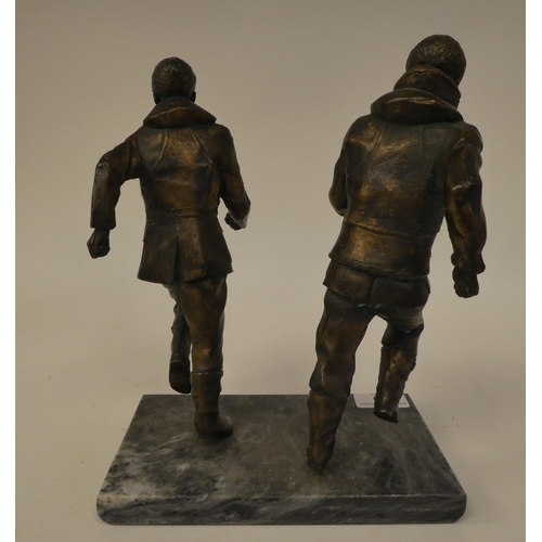 89 - A gilt bronze group, featuring two airmen, scrambling into action, on a grey marble plinth  11