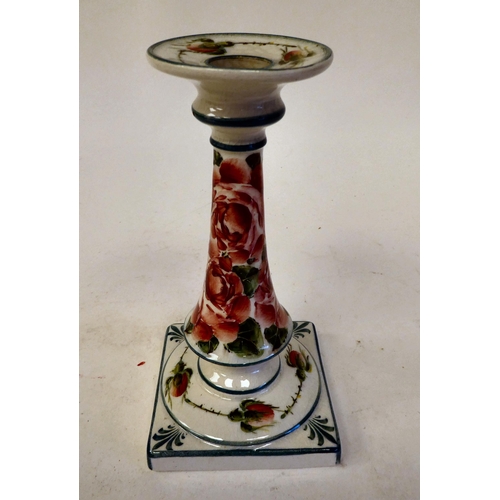 90 - A Wymess pottery candlestick with an integral, flared sconce and tapered stem, on a square base, tra... 