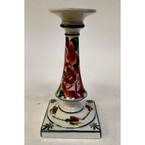 90 - A Wymess pottery candlestick with an integral, flared sconce and tapered stem, on a square base, tra... 