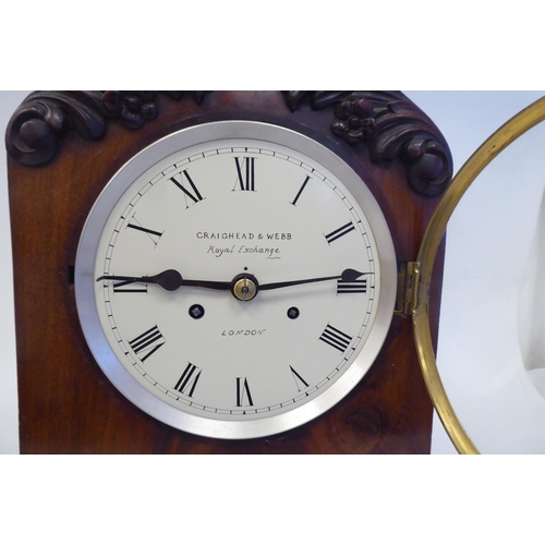 91 - A 19thC mahogany cased, pointed arch top bracket clock with applied, foliate carved mounts, on ball ... 