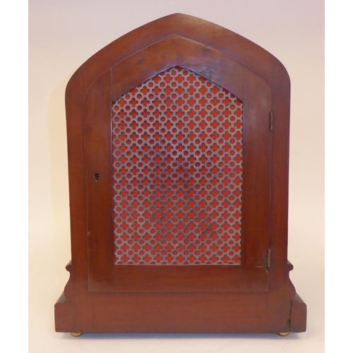 91 - A 19thC mahogany cased, pointed arch top bracket clock with applied, foliate carved mounts, on ball ... 