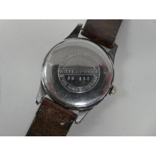 92 - An Incabloc Antimagnetic stainless steel cased wristwatch, faced by an Arabic dial, on a mid brown h... 