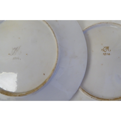 333 - A pair of early 19thC French porcelain plates, decorated with cupid charioteers and gilt ornament, i... 