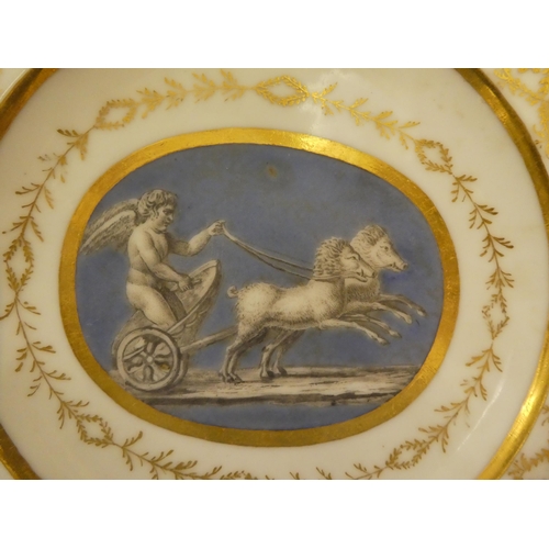 333 - A pair of early 19thC French porcelain plates, decorated with cupid charioteers and gilt ornament, i... 