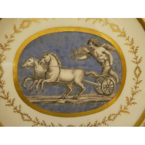 333 - A pair of early 19thC French porcelain plates, decorated with cupid charioteers and gilt ornament, i... 