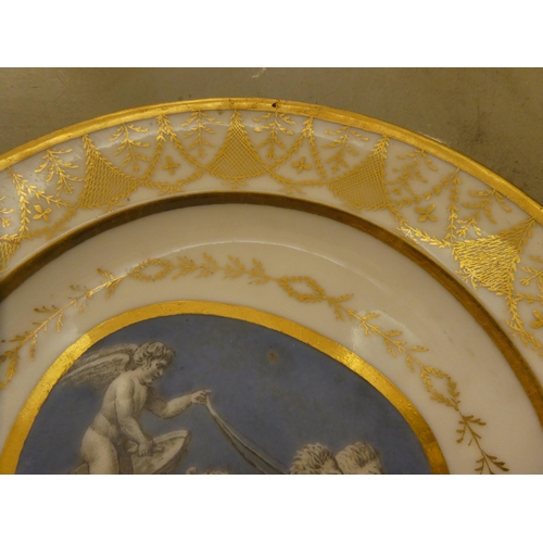 333 - A pair of early 19thC French porcelain plates, decorated with cupid charioteers and gilt ornament, i... 