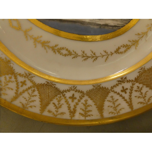 333 - A pair of early 19thC French porcelain plates, decorated with cupid charioteers and gilt ornament, i... 