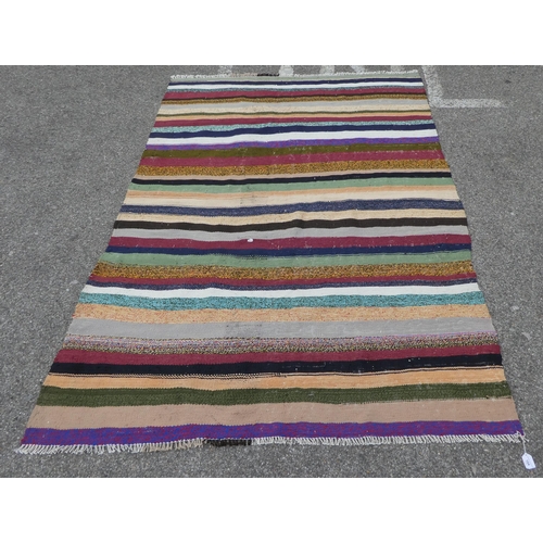 104 - A Kelim rug, decorated with coloured stripes  59