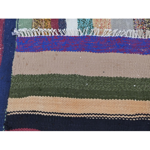 104 - A Kelim rug, decorated with coloured stripes  59