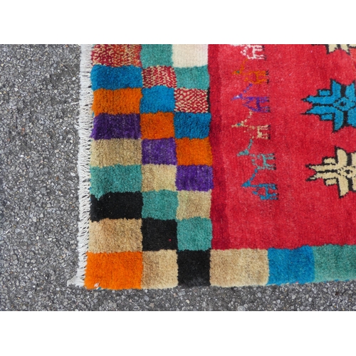 109 - An Iranian pictorial rug, depicting a deer nursing a doe, on a multi-coloured ground  45