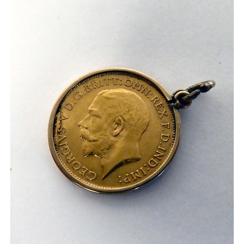 112 - A George V half sovereign, St George on the obverse  1914, in a yellow metal mount