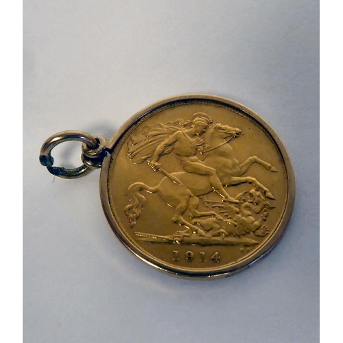 112 - A George V half sovereign, St George on the obverse  1914, in a yellow metal mount