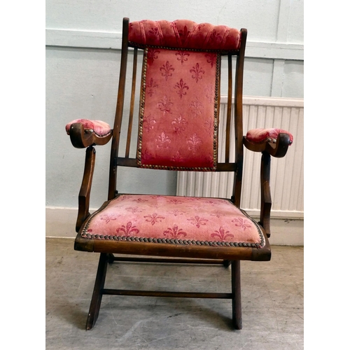 113 - A late Victorian beech framed, folding campaign style veranda chair, button upholstered in studded w... 