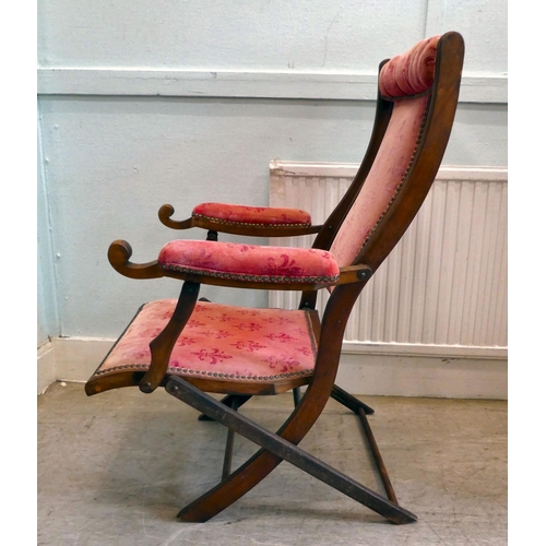 113 - A late Victorian beech framed, folding campaign style veranda chair, button upholstered in studded w... 