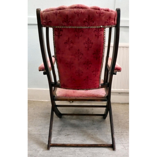 113 - A late Victorian beech framed, folding campaign style veranda chair, button upholstered in studded w... 