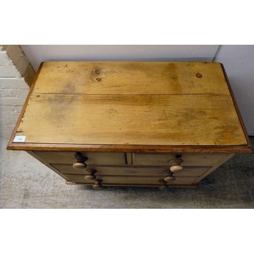 136 - An early 20thC bleached pine, four drawer dressing chest, raised on turned feet  33