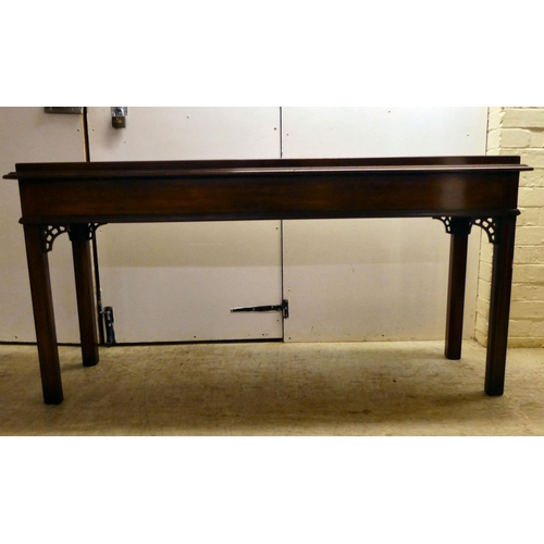 137 - A modern reproduction of a Georgian design, mahogany breakfront, three drawer hall table, raised on ... 